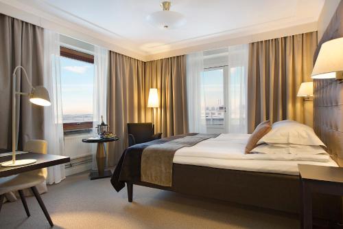 Säng eller sängar i ett rum på Elite Stadshotellet Luleå