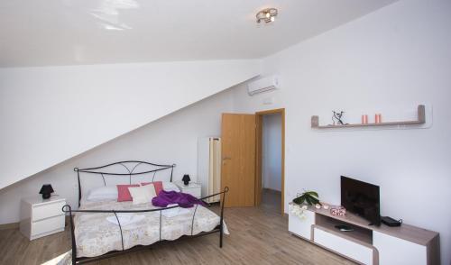 Postel nebo postele na pokoji v ubytování Apartmani J&P