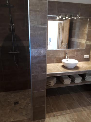 a bathroom with a sink and a mirror at gite tomasini sabrina zirilla in Monacia-dʼAullène