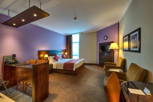 Postel nebo postele na pokoji v ubytování J5 RIMAL Hotel Apartments
