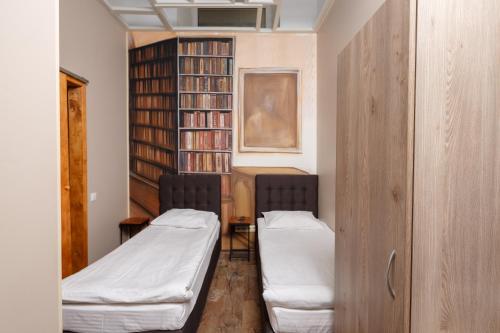 Un ou plusieurs lits dans un hébergement de l'établissement Mezzanine Hotel