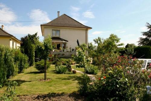 a house with a garden in front of it at Studio Rouffach in Rouffach