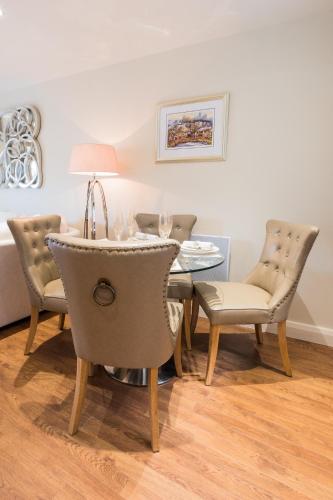 a dining room with a table and chairs at Riverside Retreat - Durham in Durham