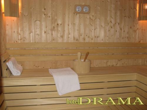 a wooden sauna with a towel on thevisor at Hotel Drama Burgas in Burgas