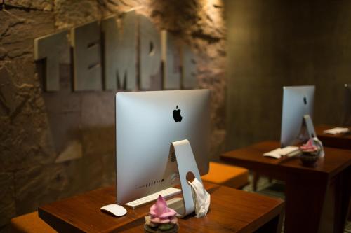 an apple computer sitting on top of a desk at Golden Temple Boutique in Siem Reap