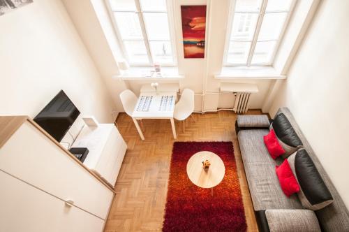 a living room with a couch and a table at Elegant Apartment Royal Castle in Warsaw