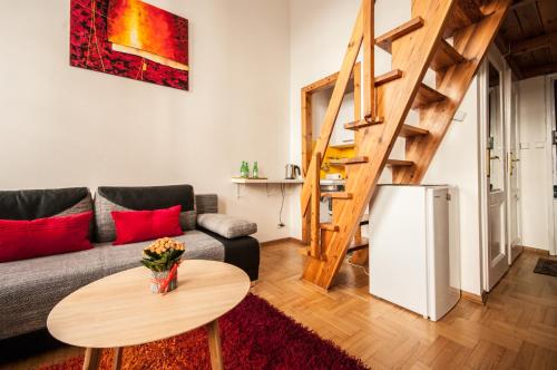 a living room with a couch and a table at Elegant Apartment Royal Castle in Warsaw