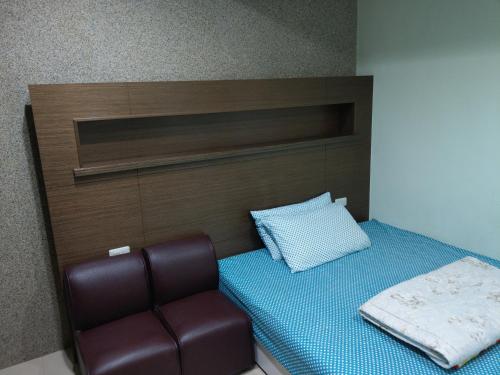 Кровать или кровати в номере 永春棧Kozzy Apartment