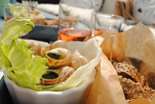 a basket of food with lettuce and other foods at Lavender Village in Kiemeliai