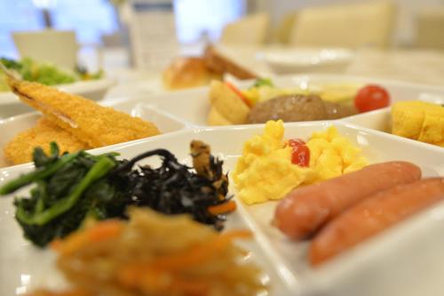 a tray of different types of food on a table at APA Hotel Isehara-Ekimae in Isehara