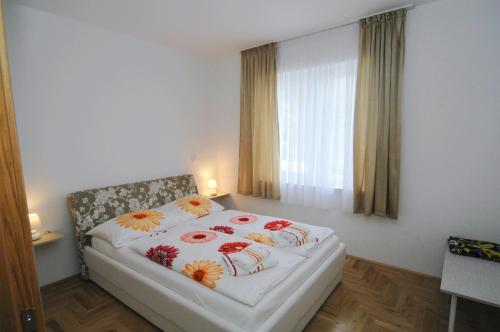 En eller flere senge i et værelse på Haus Zora Feerienwohnung 8