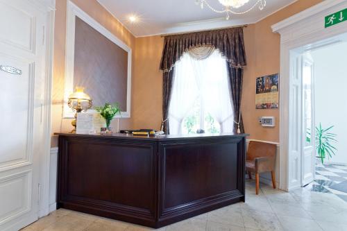 a home office with a desk in front of a window at Pałac Pawłowice in Gorz