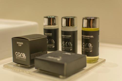 a group of three products sitting on a shelf at Novotel Medellin El Tesoro in Medellín