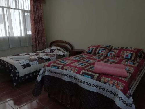 Кровать или кровати в номере Apartamento Golden