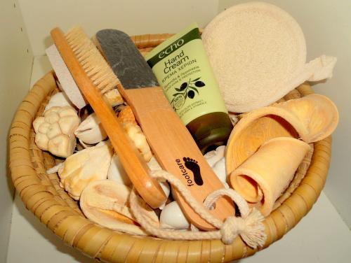 a wicker basket with a knife and other items at Aloe Villa Chania Crete in Georgioupolis