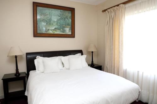Ένα ή περισσότερα κρεβάτια σε δωμάτιο στο Kingston Place Guesthouse