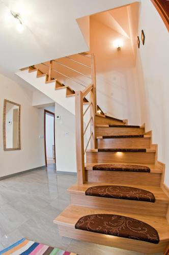 a staircase in a house with wooden steps at Miodowy Zakątek in Łabowa