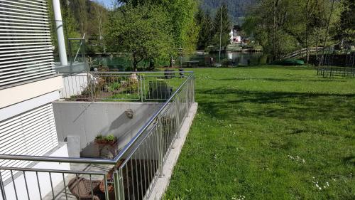 a garden on the side of a house at Chalet am See in Nassereith