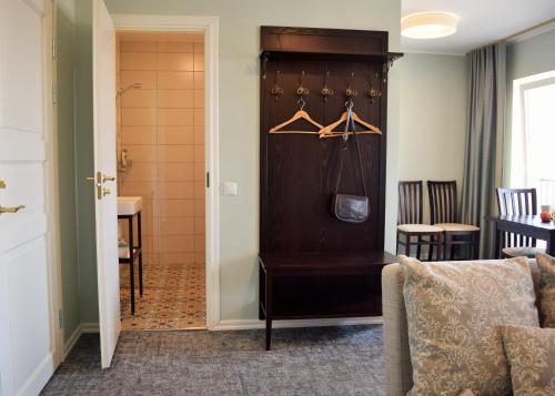 a room with a closet with a table and chairs at Otepää Apartments in Otepää