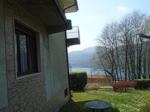 a window of a house with a view of a lake at Bellavista in Pettenasco