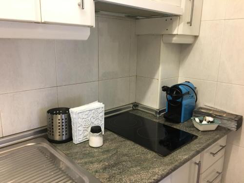 a small kitchen with a counter and a sink at Apartamento en el centro in Ceuta