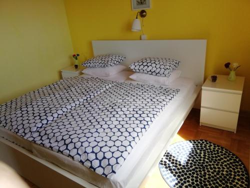 a bedroom with a large bed with two pillows at Panoramic view studio in Rab