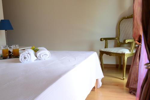 a hotel room with a bed with towels on it at Eco Villa in Mákri