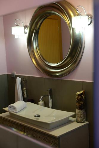 a bathroom with a sink and a mirror at Eco Villa in Mákri