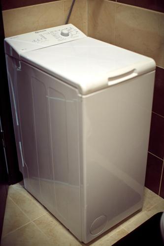 a white refrigerator sitting on top of a counter at Babylon Apartments On Dubenska Street in Rivne