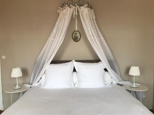 Ein Bett oder Betten in einem Zimmer der Unterkunft B&B Le Cloître St Joseph