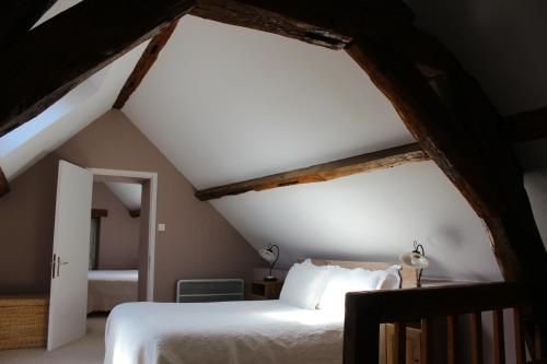 En eller flere senge i et værelse på La Maison Chaudenay