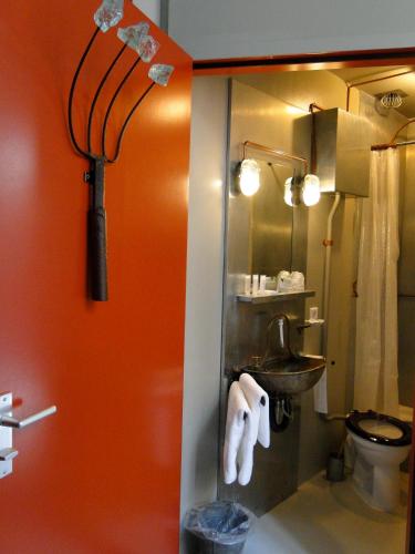a bathroom with a sink and a toilet at LABnul50 self check-in hotel Groningen in Groningen