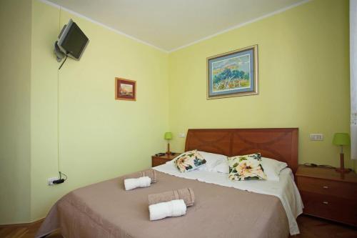 Postel nebo postele na pokoji v ubytování Apartment Pia