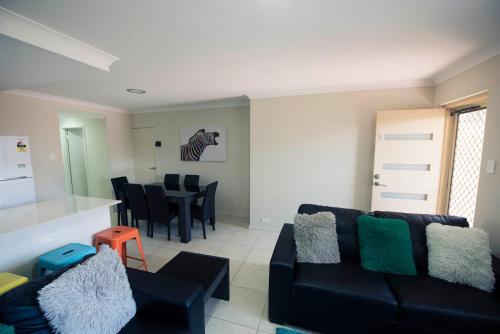 a living room with a couch and a table at Midland Haven - Midland WA in Midland Junction