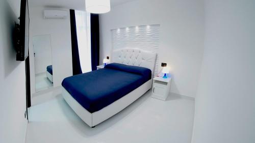 Ein Bett oder Betten in einem Zimmer der Unterkunft Beverello Suite