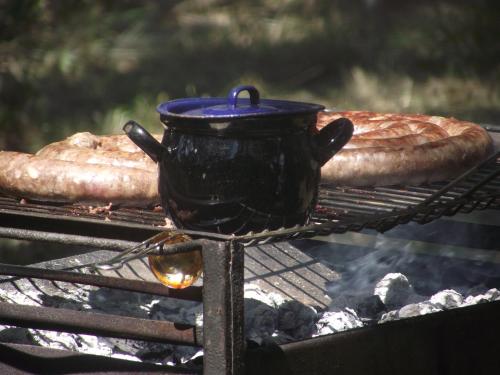 a pot and a loaf of bread on a grill at Shamba Yetu Mountain Lodge in Maanhaarrand