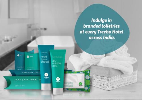 a picture ofbranded products in a bathroom with a mirror at Hotel Crown Suites in Cochin