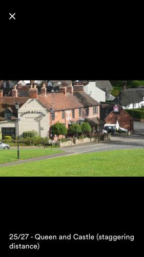 a picture of a town with a street and houses at Kenilworth Cosy Garden View Apartment in Kenilworth