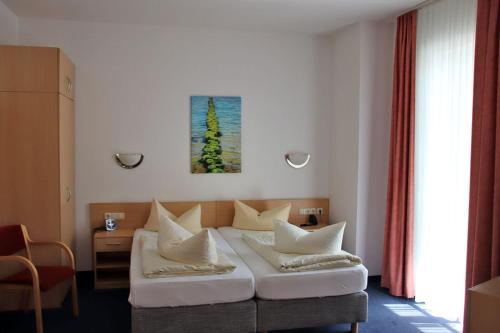 Postel nebo postele na pokoji v ubytování Hotel Garni Meeresgruß
