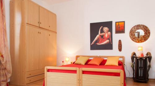 a bedroom with a bed and a dresser in it at Is Cogas in Masainas