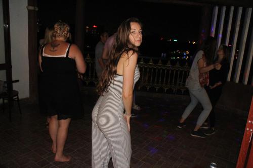 two women dancing on a dance floor at a party at Nam Phương Riverside Villa in Hue