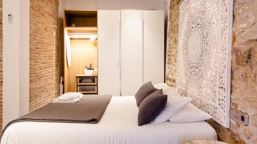 Postel nebo postele na pokoji v ubytování Ferreries Boutique Apartment