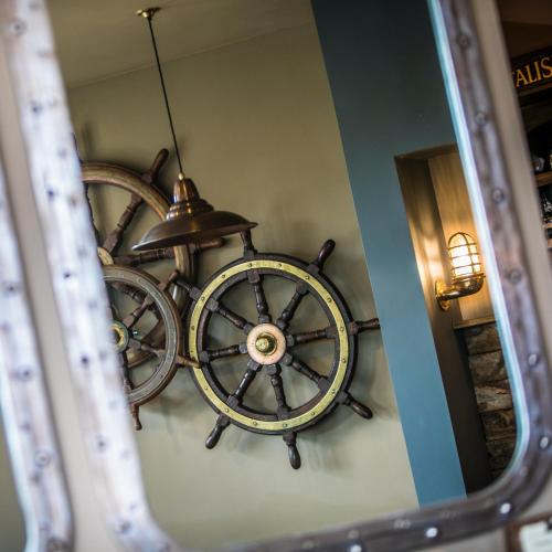 a chandelier hanging from the ceiling in a room at The Bath Hotel in Lynmouth