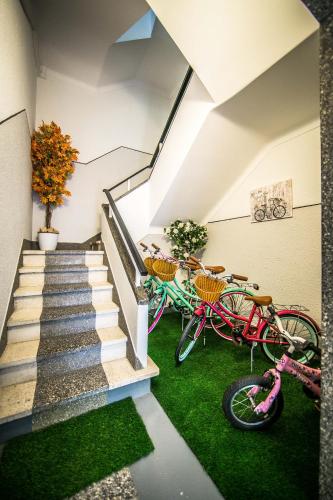 two bikes parked in a room with stairs at Dream city home 2 in Caldas da Rainha