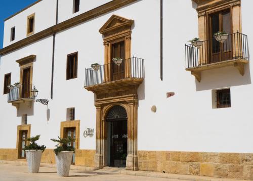 an entrance to a building with two balconies at Hotel Carmine in Marsala