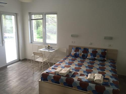 Postel nebo postele na pokoji v ubytování Apartmani Alex Beach