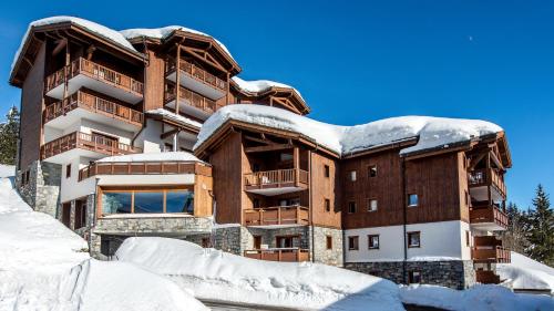 a building in the snow with snow covered at CGH Résidence Boutique Le Lodge Hemera in La Rosière