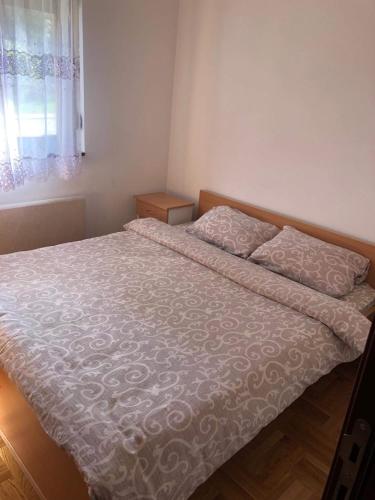 En eller flere senge i et værelse på Apartman Lenka