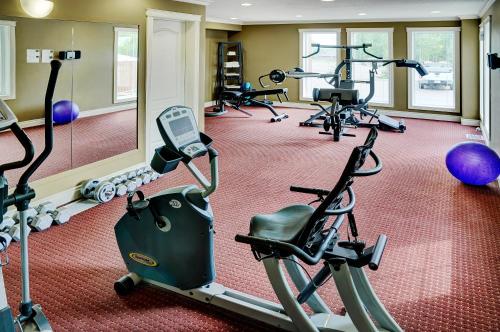 a gym with several exercise bikes in a room at Lakeview Inns & Suites - Edson Airport West in Edson