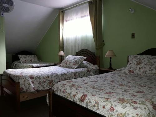 Llit o llits en una habitació de Cabañas Mataveri